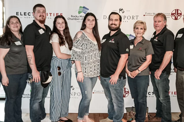 The team at Rocky Mount Electric Motor standing for a photo for small business month.