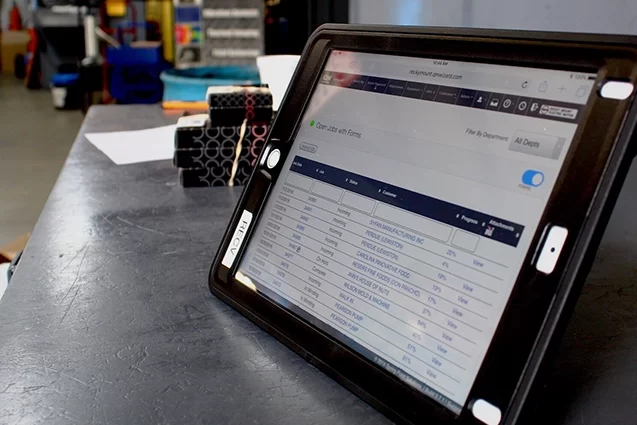 A tablet displaying a quality management system within an electric motor service company.