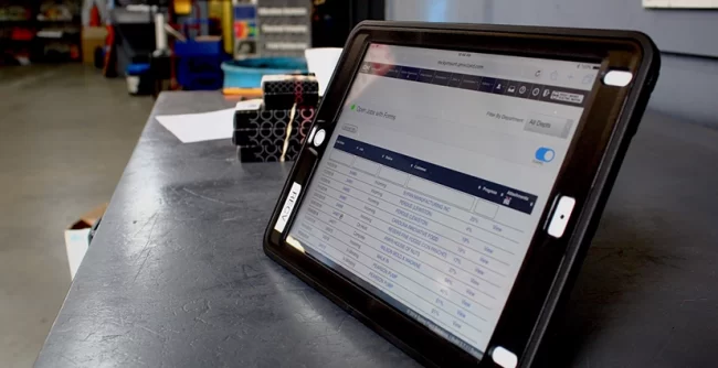 quality-mgmt-system A tablet displaying a quality management system within an electric motor service company.