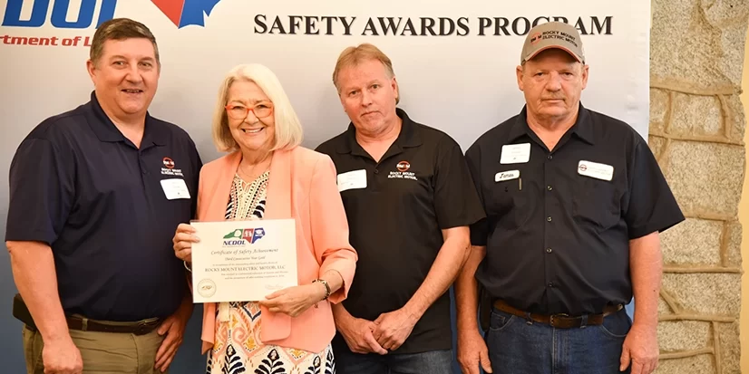 safety-award Rocky Mount Electric Motor accepting their certificate of safety achievement from NCDOL.
