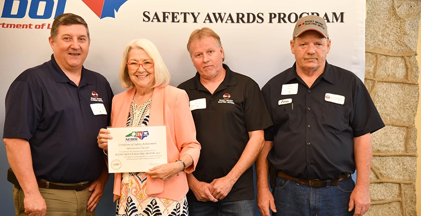 safety-award Rocky Mount Electric Motor accepting their certificate of safety achievement from NCDOL.