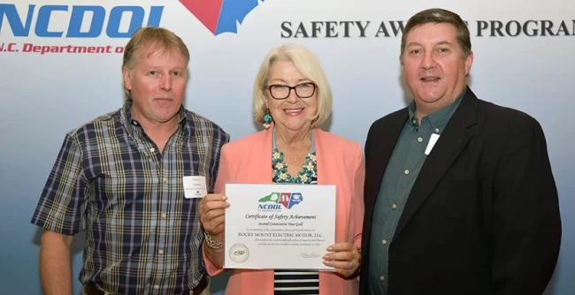 safety-award2 Rocky Mount Electric Motor accepting their certificate of safety achievement from NCDOL.
