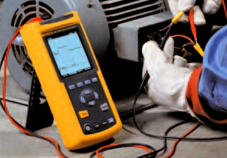 electrical app diagnostics A worker diagnosing common electric motor problems.