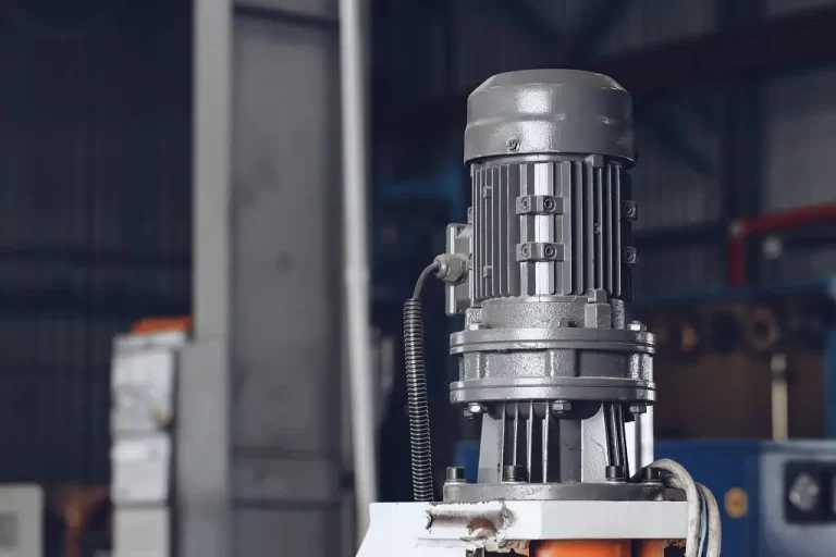 An electric motor standing vertically in a metal production in a cable plant.