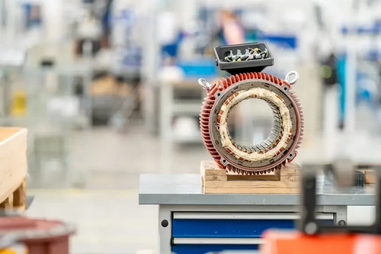 Part of an AC electric motor housing in a production line.